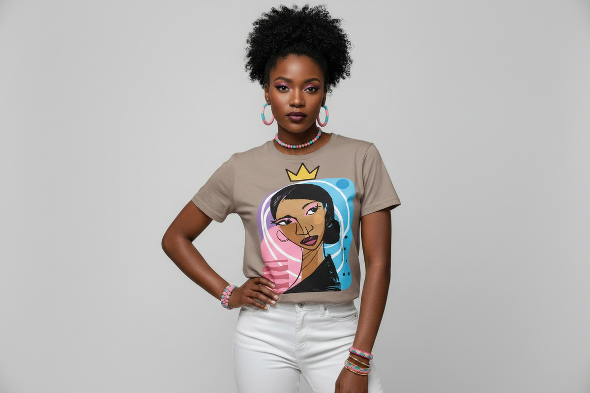 Woman wearing a t-shirt with a graphic design of a woman with a crown on a gray background